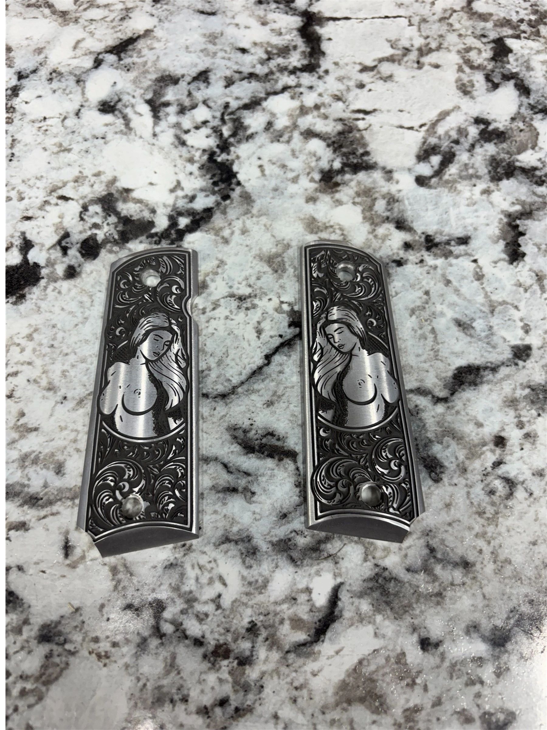 Ornate engraved gun grips